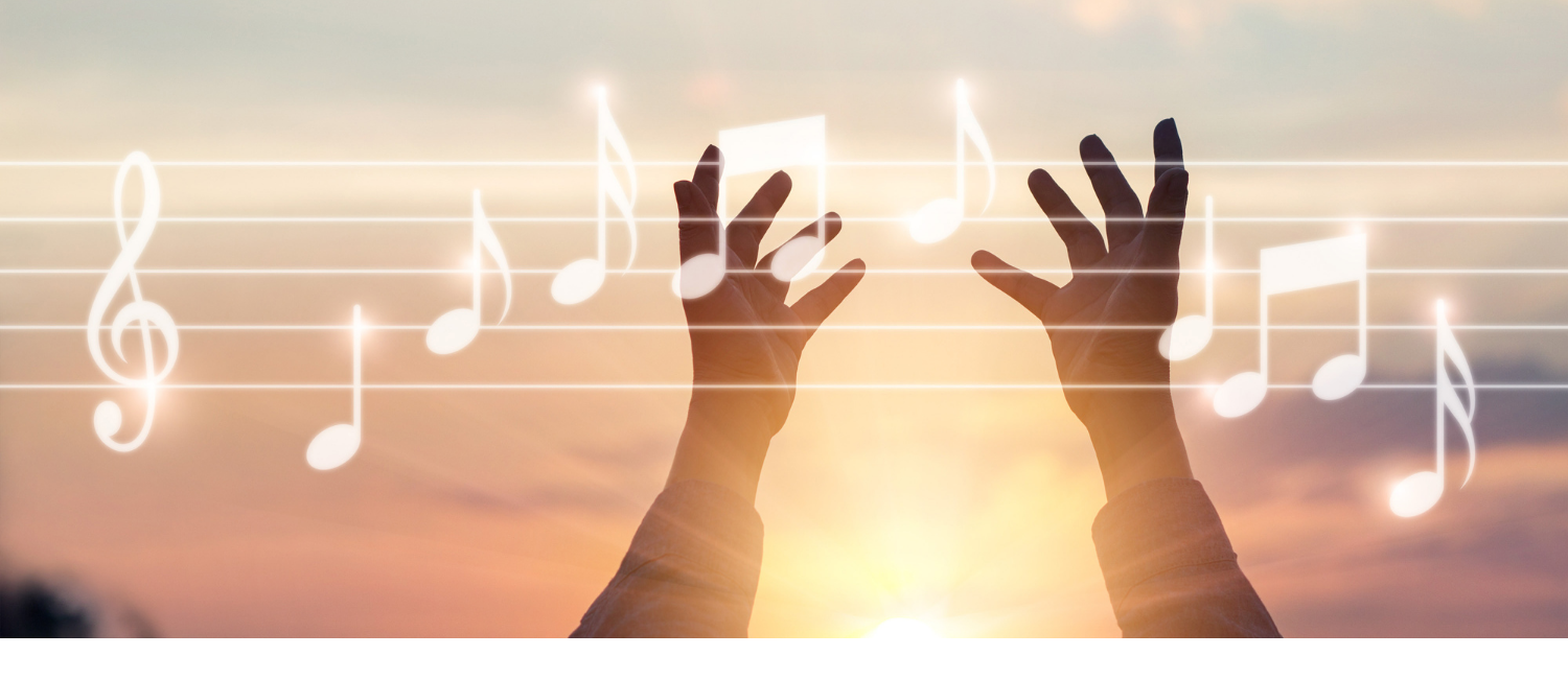 hands in air with music staff